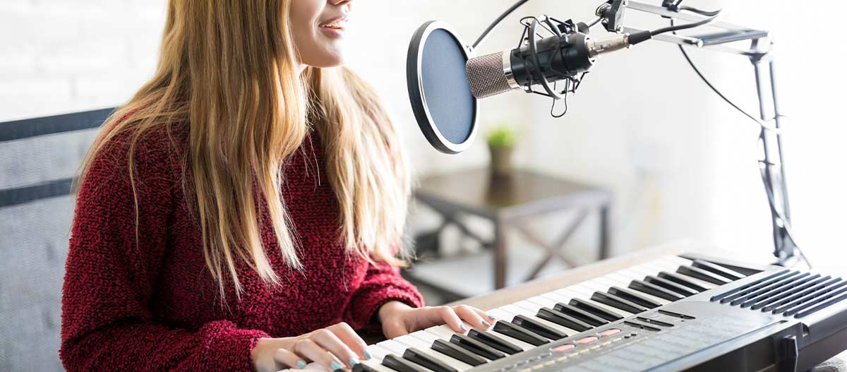 Adult singer practising octaves and vocal range with a microphone