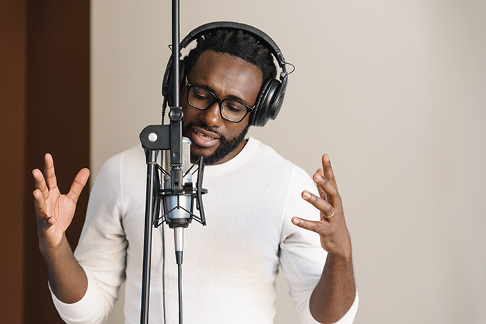 African man singing in studio