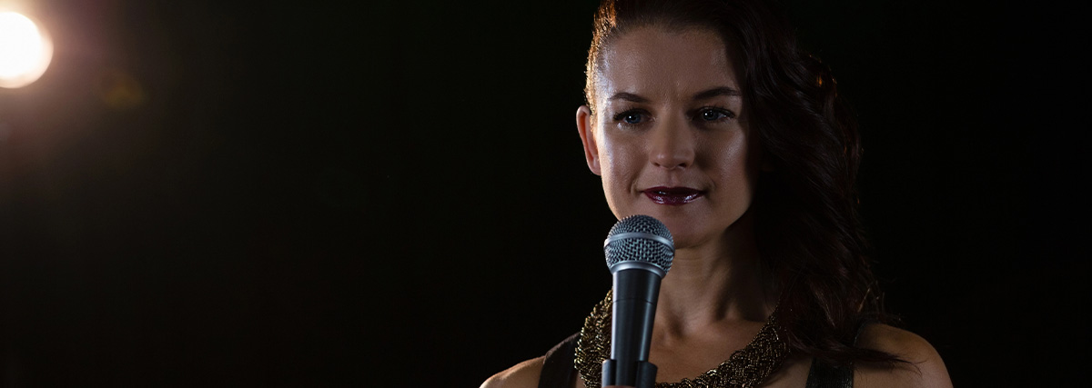 Beautiful woman holding a microphone