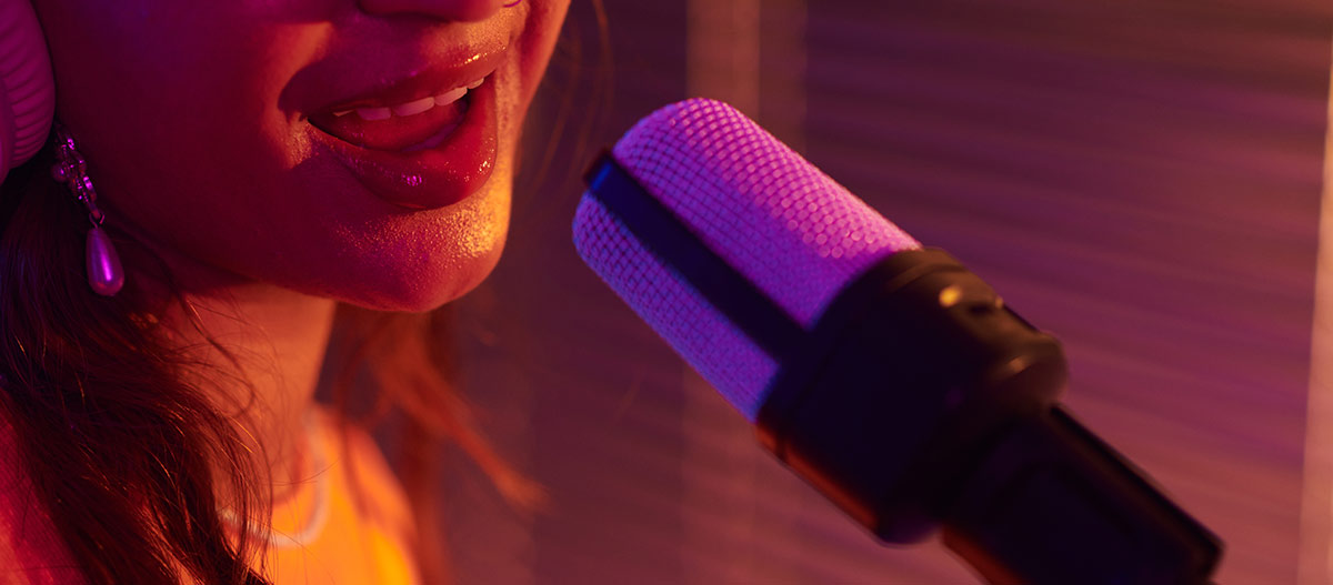 Close up of a singer using a microphone during vocal practice