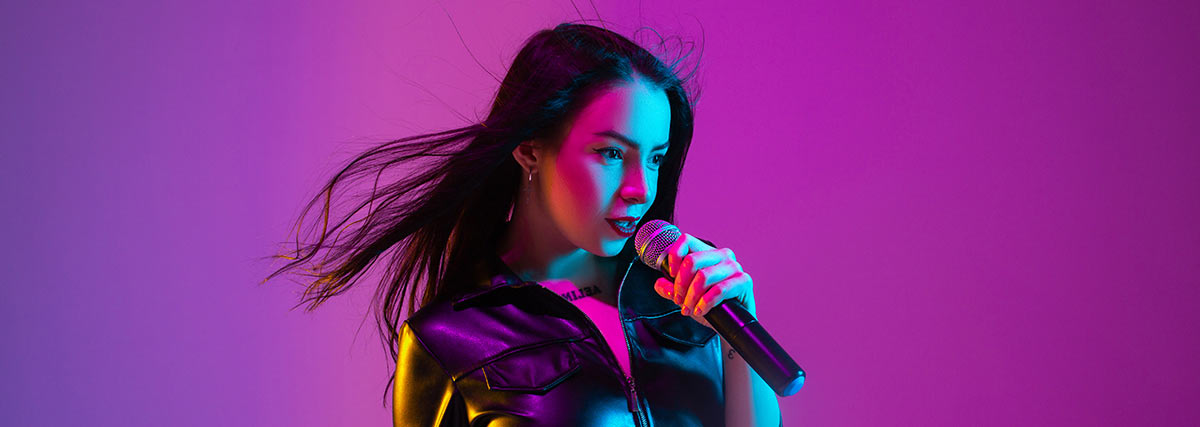 confident female singing with microphone