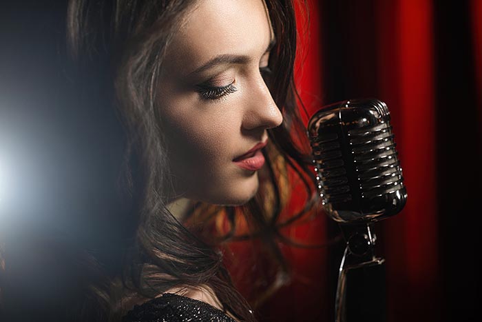 female singer performing feat
