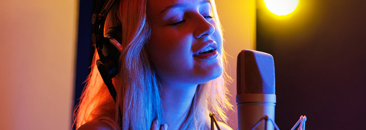 Girl is singing in studio