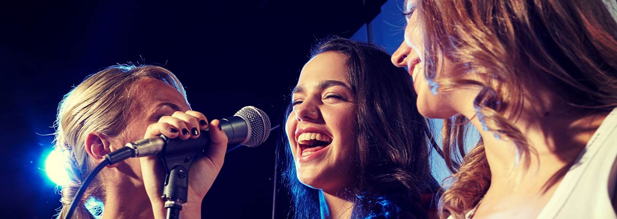 Group of female singing and having fun