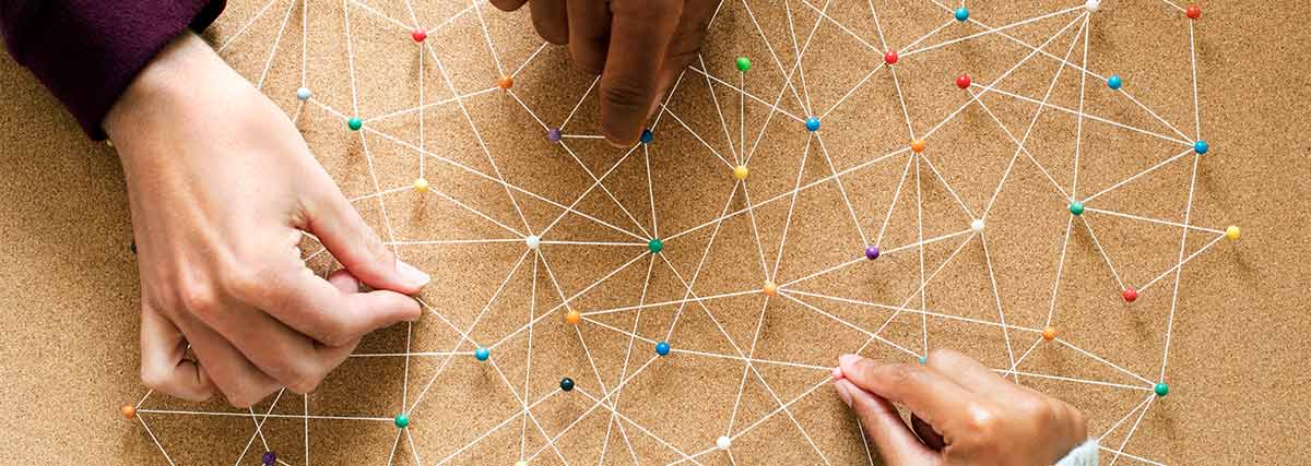 Hands connecting the pins