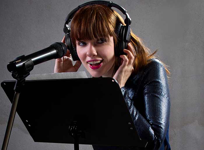 Lady looking at a score while singing