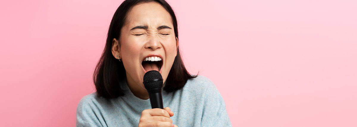 Lady singing with close eyes