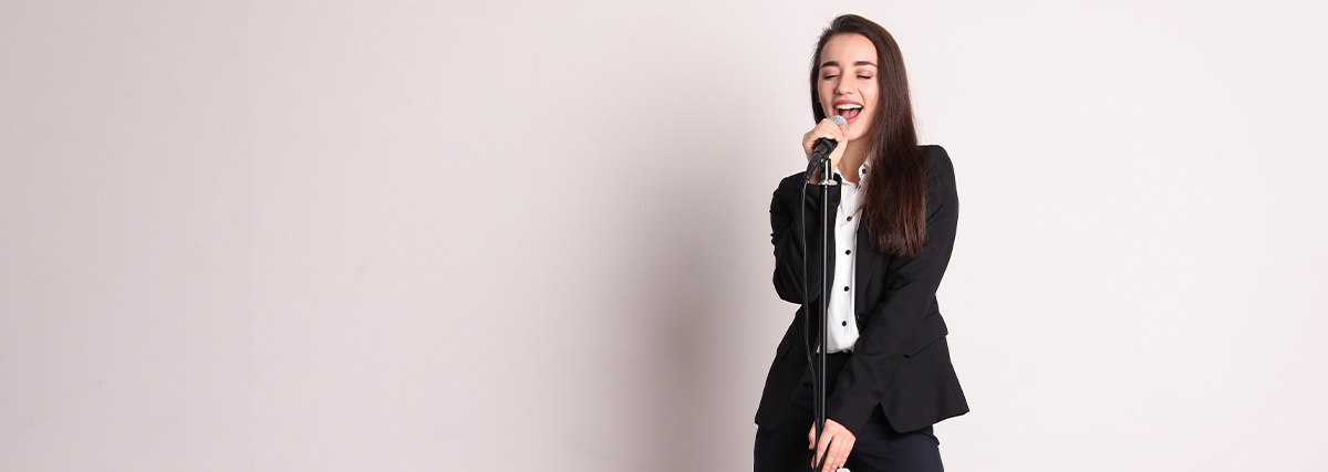 Lady standing and singing