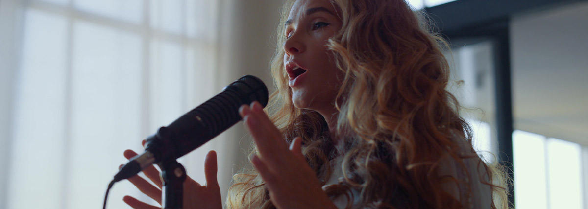 Lady with curl hair singing