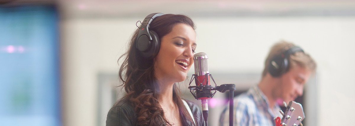 Lady with headphone singing with close eyes