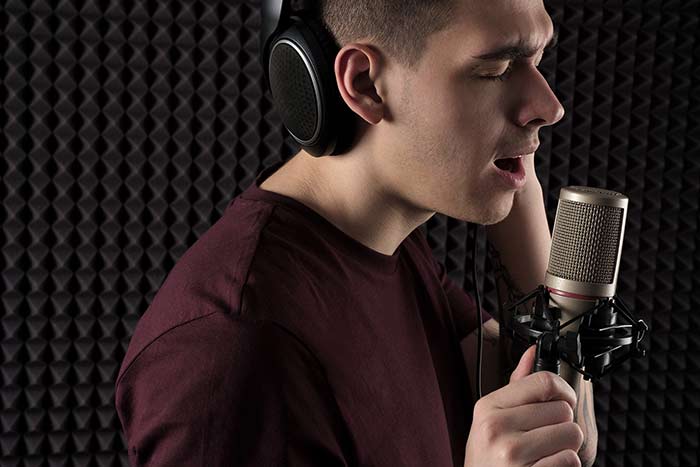male singer in studio feat