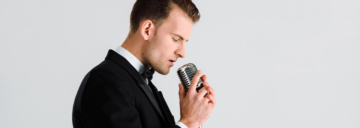 Man in suit singing