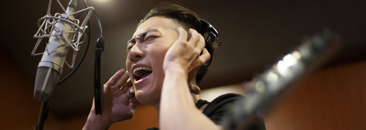Man singing in studio