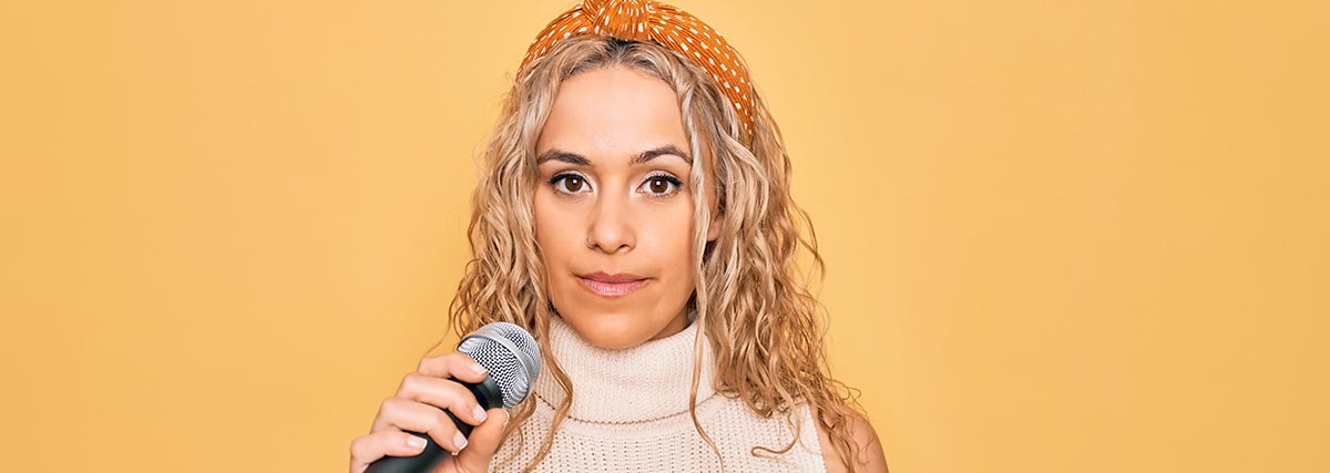 serious woman with mic