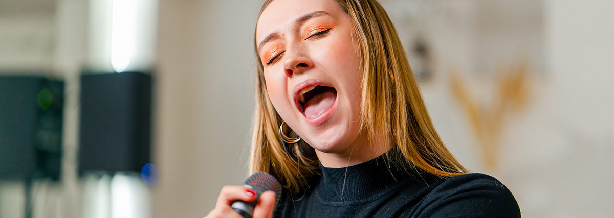Singer hitting high notes