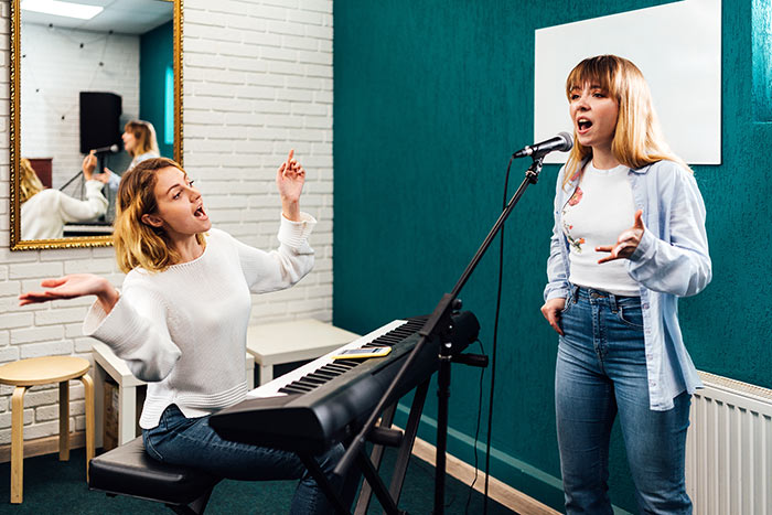 Teacher and student having singing lesson