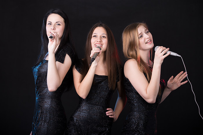 Three beautiful ladies singing together