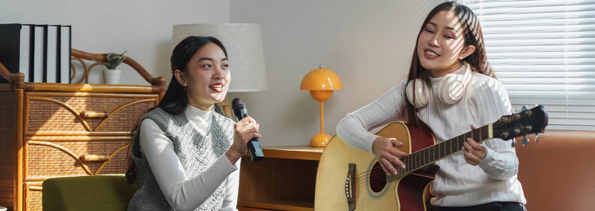 Two women practicing singing