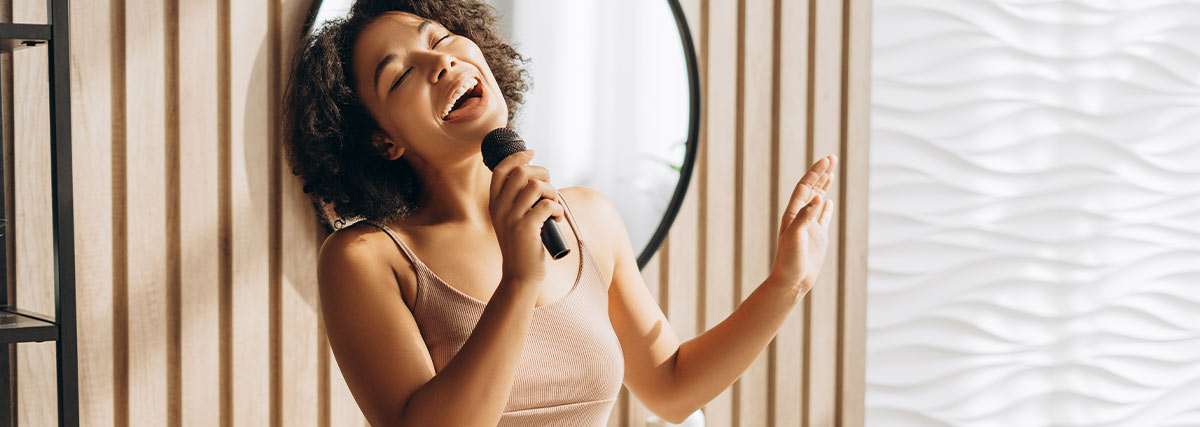 Woman in bathroom singing