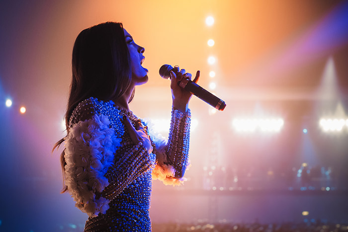Woman singing on stage
