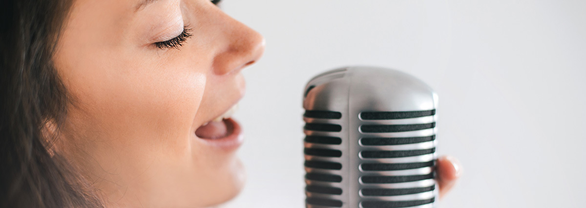 Woman singing with microphone