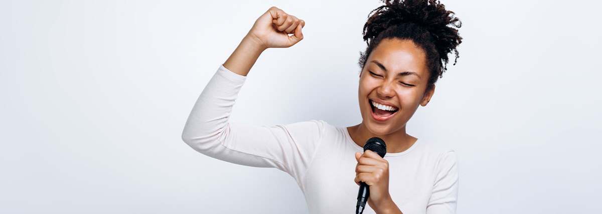 Woman with curled hairs singing